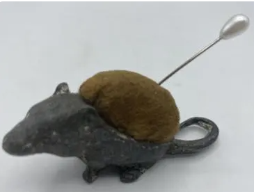 Antique sewing needle cushion shaped like a field mouse, from the 1900s