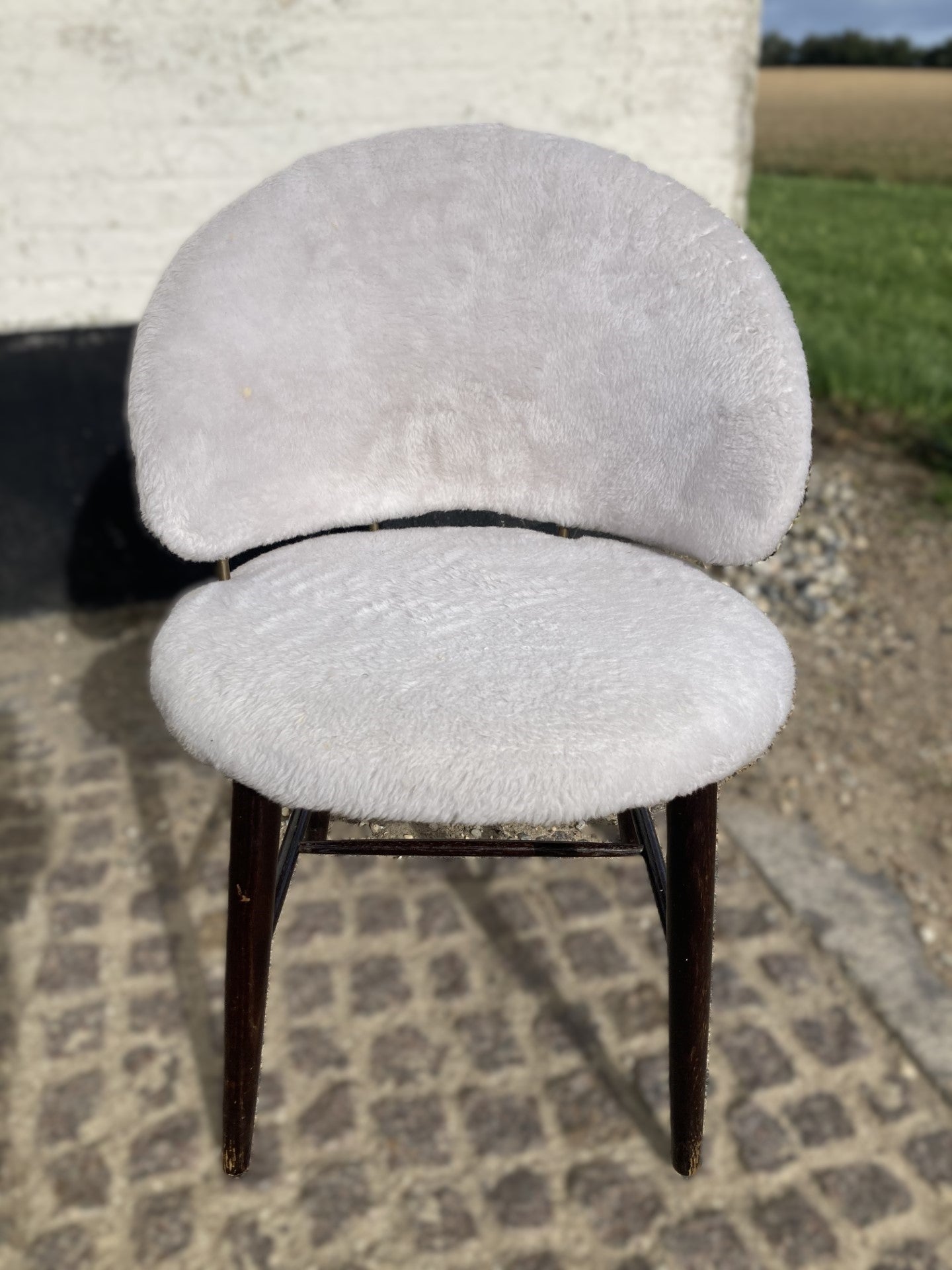 Elegant upholstered chair with brass details - no. 0470