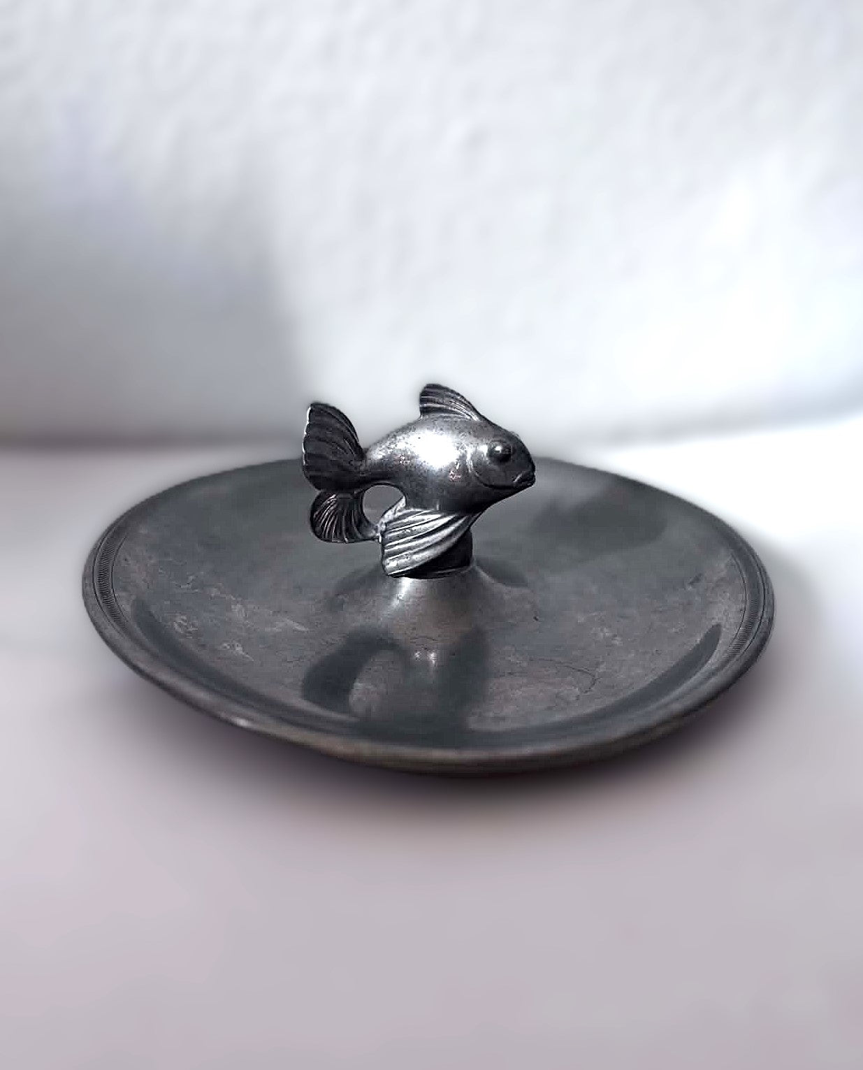 Just Andersen (Denmark, 1884-1943), Art Deco circular pewter dish with fish