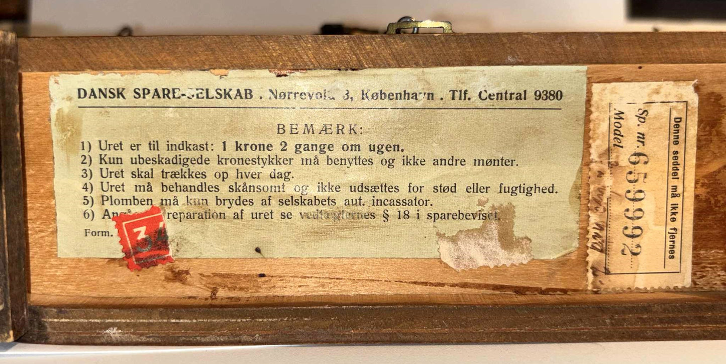 Rare Danish functioning money clock with coin insert from the 1940s-50s